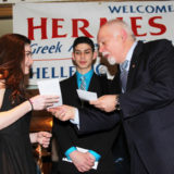 Scholarships Paul Kotrotsios gives the Scholarship Awards to Constantine Konstantopoulos and Lia Locke of the Aristotle academy Delco residentsIMG_0853