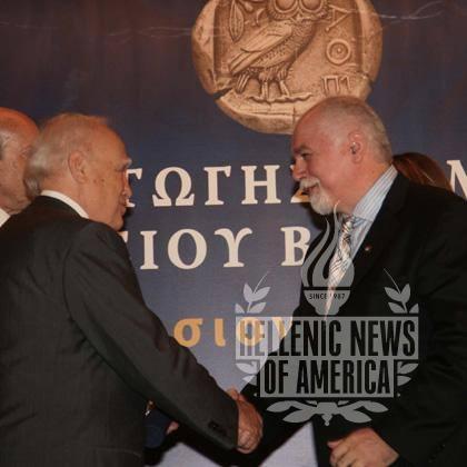 Former President of Greece, Karolos Papoulias awards Paul Kotrotsios the Botsis Award for Journalism