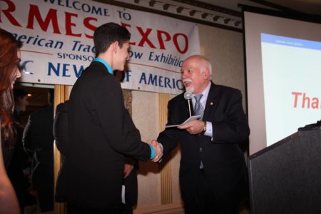 Paul Kotrotsios awarding a student with the Hellenic News Scholarship