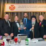 Efstratios Valamios, center, is presented with the Athenagoras Human Rights Award, and joined by [L-R] Dr. Konstantinos Koutras, Consul General of Greece; Archon John A. Catsimatidis, recipient of the Nicholas J. Bouras Award; Archon Reince Priebus; Archbishop Demetrios; National Commander Dr. Anthony J. Limberakis; and Archon Mike Emanuel, Chief Congressional / Senior Political Correspondent at FOX News and evening Master of Ceremonies. (Photos by J. Mindala)