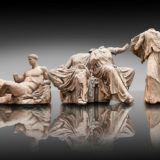 Figures from the East Pediment of the Parthenon, Acropolis Athens. From left to right cat no D Dionysos ,middle E & F Demeter & Persephone, left G Hebe. British Museum London Exhibit