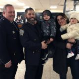 111th Precinct, Deputy Inspector William McBride (left) with Officer Constantine Saoulis and family.