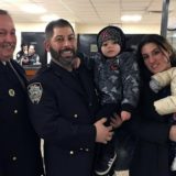 111th Precinct, Deputy Inspector William McBride (left) with Officer Constantine Saoulis and family.
