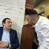 Petridis son talking to Nikos Stergiou of Megas Yeeros IMG_9580