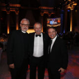 Father Alexander Karloutsos, Honorary Advisor, stands with Andrew N. Liveris and Peter Diamandis at The Hellenic Initiative Gala.