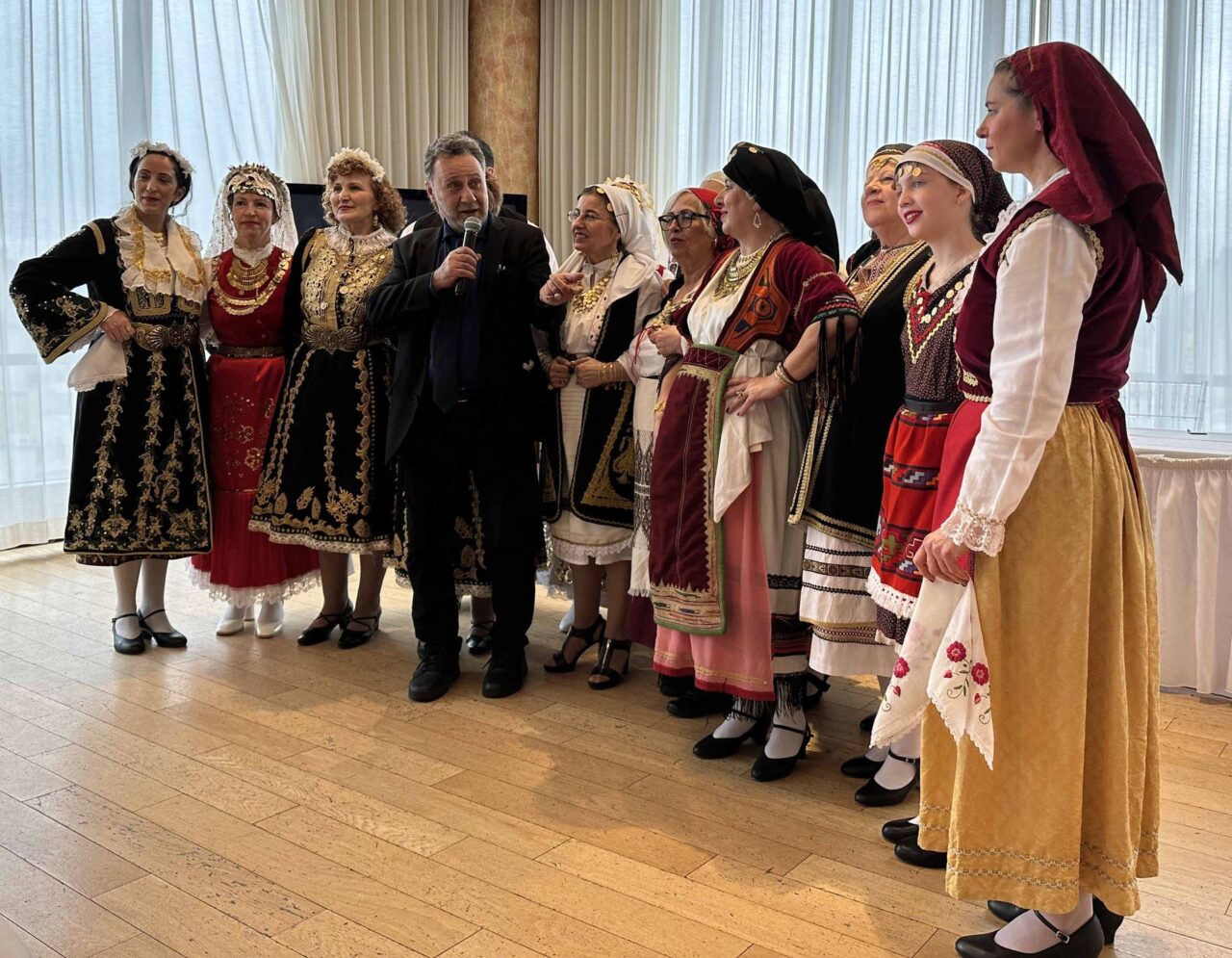 Prof. Alexiou (center) congratulating the Dance and Polyphonic Group of the Academy of the Hellenic Paideia