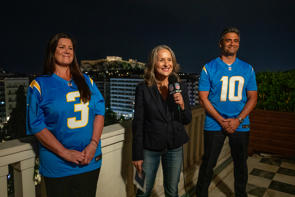 Charge d’Affaires at the U.S. Embassy in Athens, Maria Olson with Chargers fans Debbie and Steve Stackiewicz.