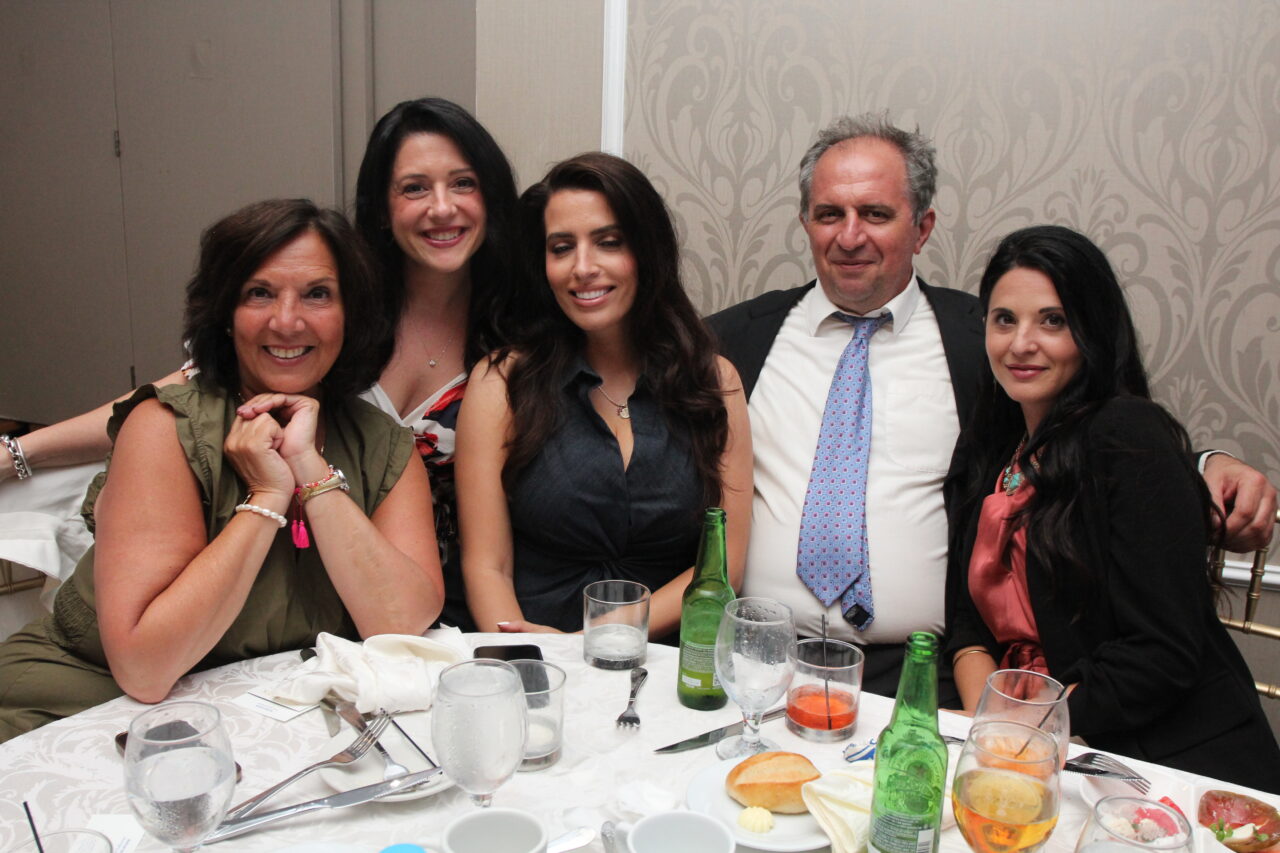 Greek-American leaders and business professionals standing together at the Hermes Expo.