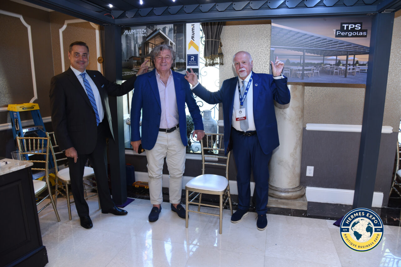 Greek-American leaders and business professionals standing together at the Hermes Expo.