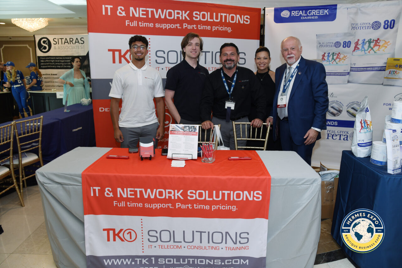 Greek-American leaders and business professionals standing together at the Hermes Expo.