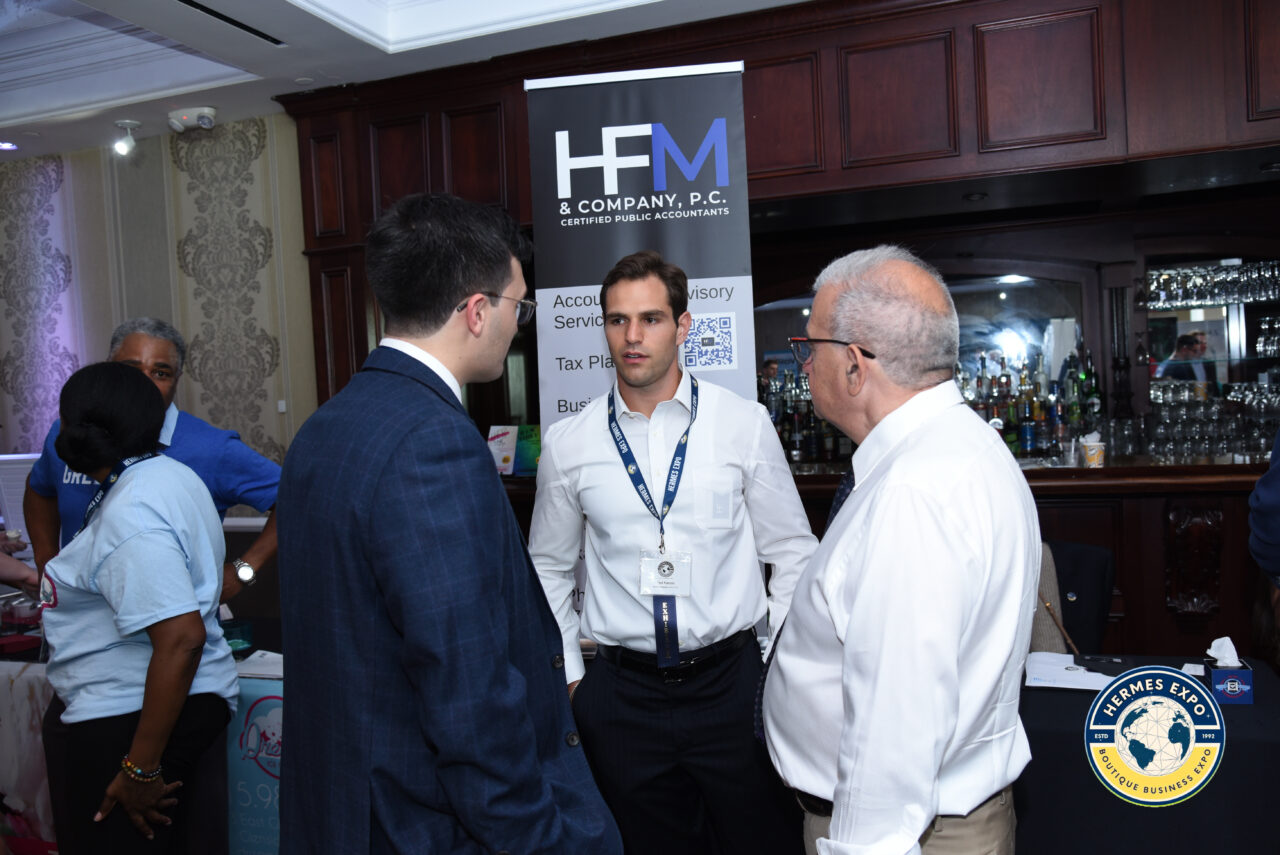 Greek-American leaders and business professionals standing together at the Hermes Expo.