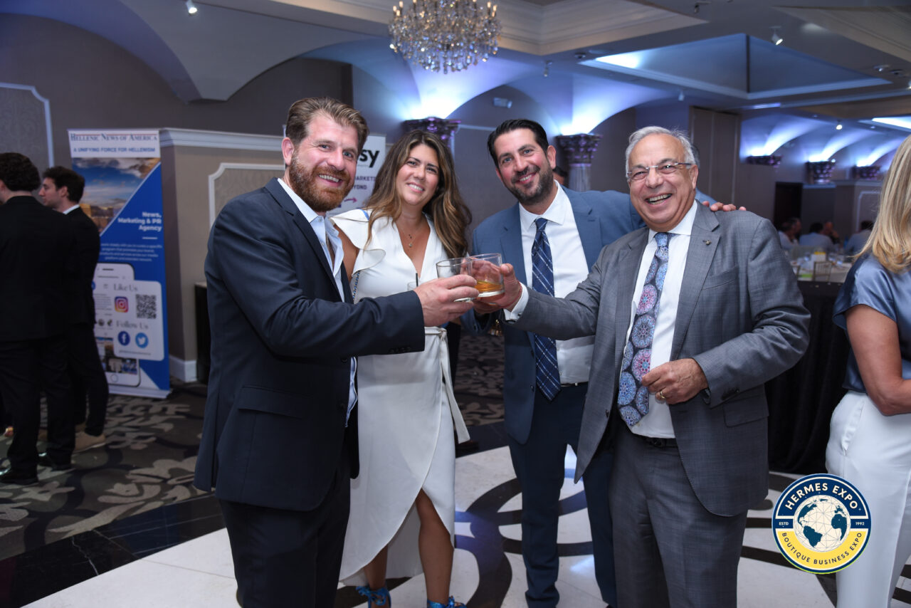 Greek-American leaders and business professionals standing together at the Hermes Expo.