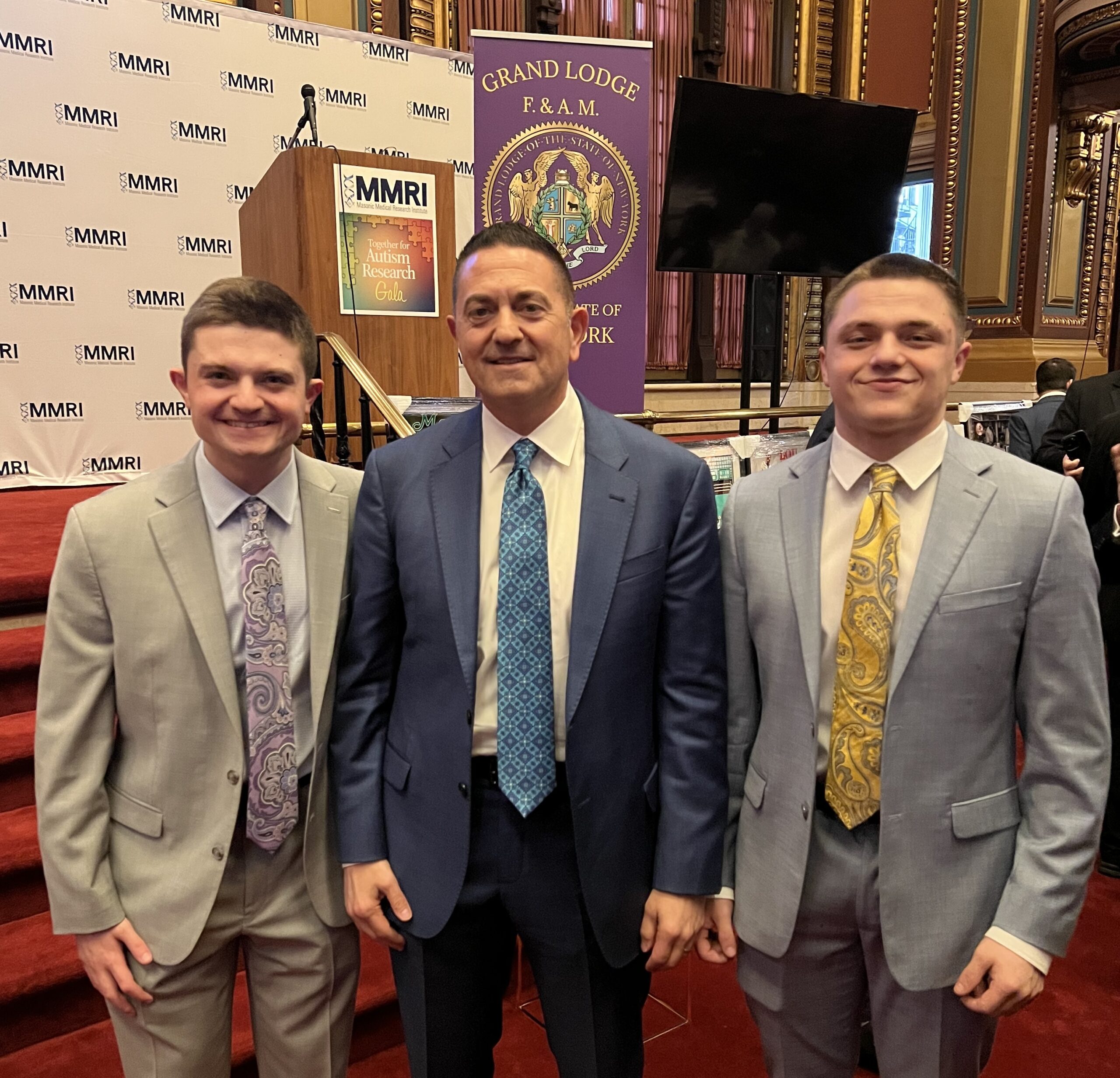 Harry Psaros with his sons Gus and Max, keynote speaker at the MMRI autism awareness gala.