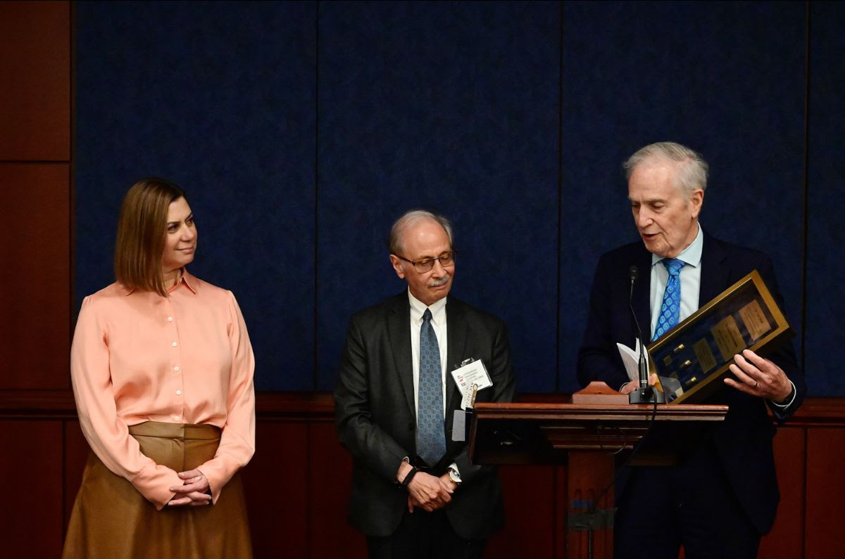 Andy Manatos and Basil Simon present Senator Slotkin with the Frizis Award