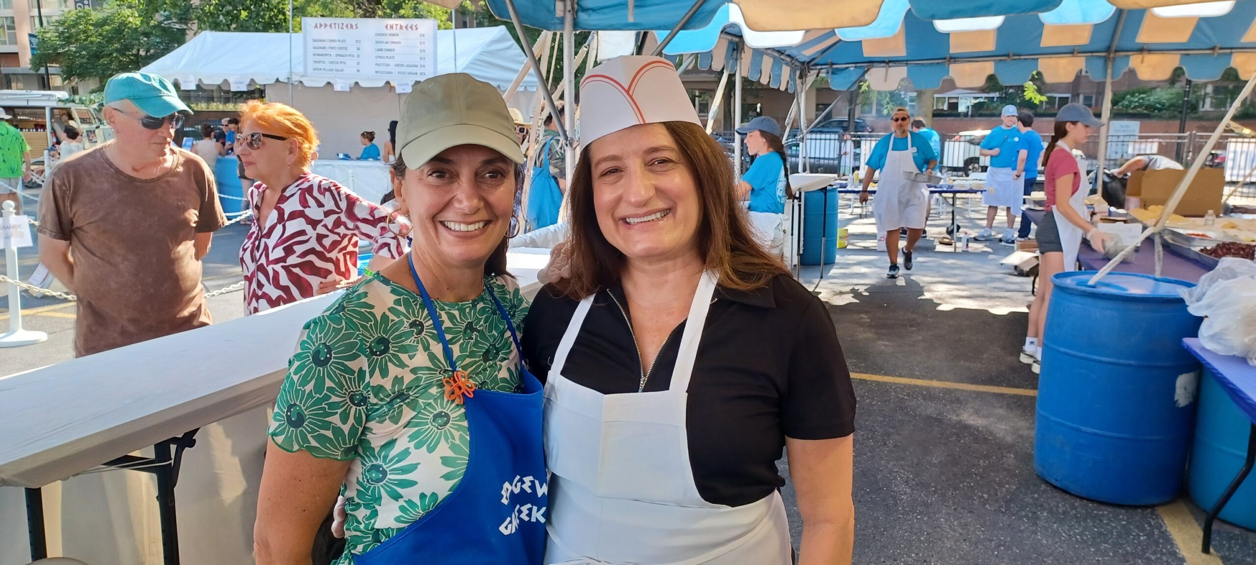 `Politico scientist' Shia Kapos (right) in the lab cooking up some delicious delicacies at the St. Andrews Greekfest in July (IMAGE CREDIT: Diane Alexander White photography)