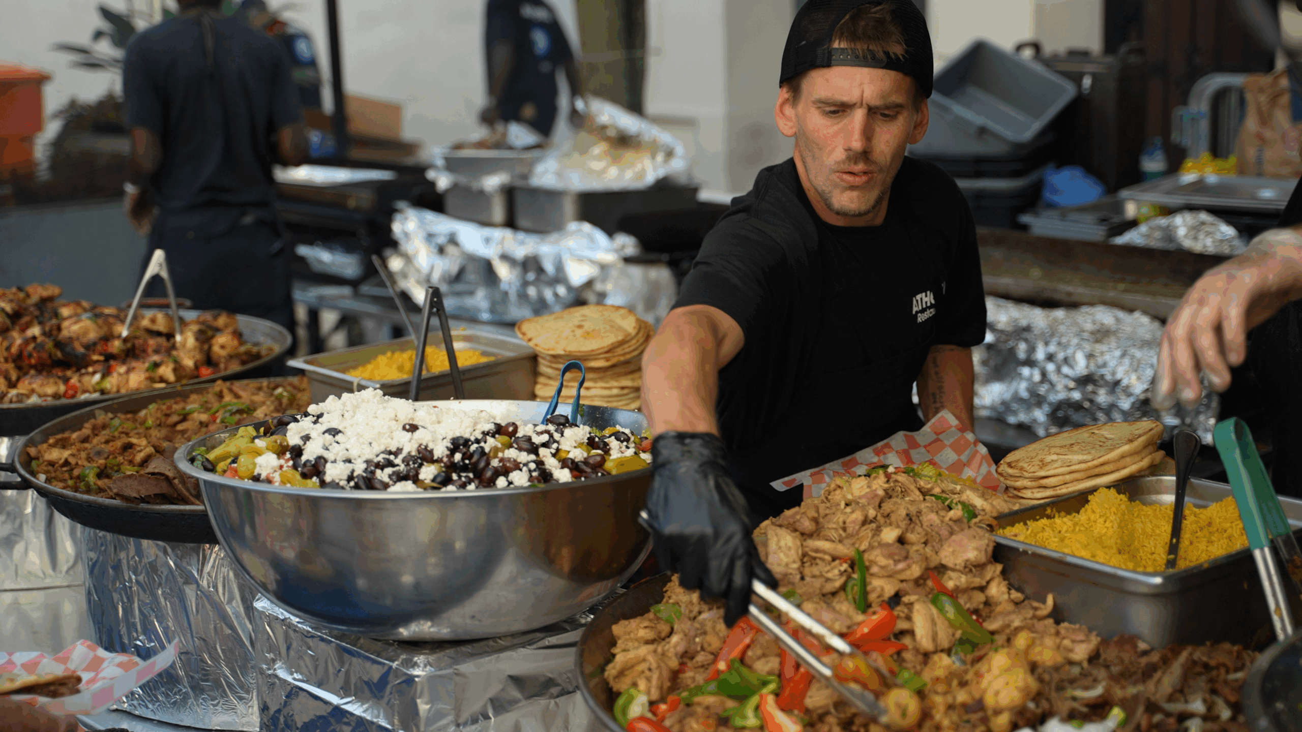 Crowds enjoying Taste of Greektown 2025 on Halsted Street, sponsored by Grecian Delight | Kronos.