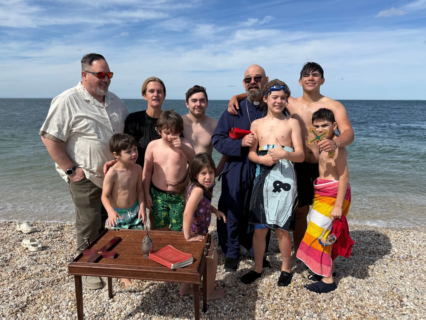 Divers with Brian Vezeis (left) and Father Andrew Cadieux.