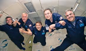Photo c. 2010. Dr. Peter H. Diamandis (center) joined on his Zero-g parabolic flight by, among others, Space X founder Elon Musk (second from right) and Jim Giannopoulos (far right), then head of 20th Century FOX Film Studios (IMAGE CREDIT: Zero-g, Dr. Diamandis). Diamandis also flew famous astrophysicist Dr. Stephen Hawking on a separate Zero-g flight