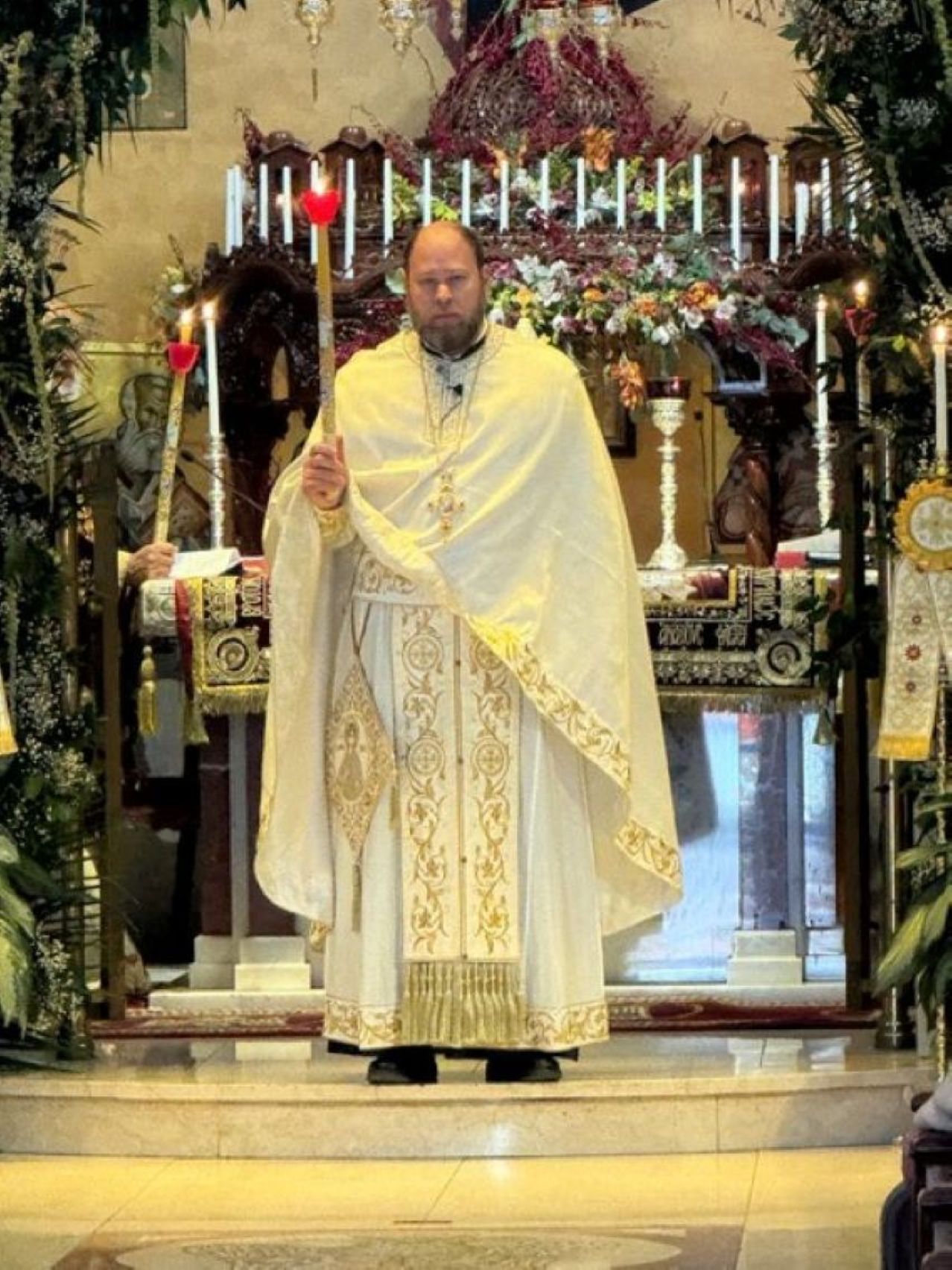 Rev. Economos Aristidis Garinis giving Easter blessings on Sunday Easter Vespers services