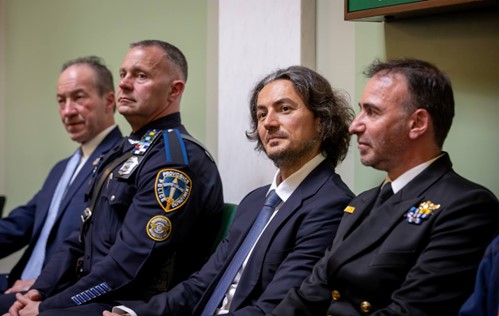 Brown University and former Providence Police Chief Hugh Clements and Providence Police Department Officer Trent Hastings on the Senate floor. George Psipsikas and Hellenic Navy Commander George Kapnisis from the United States Naval War College in Newport, RI joined them.