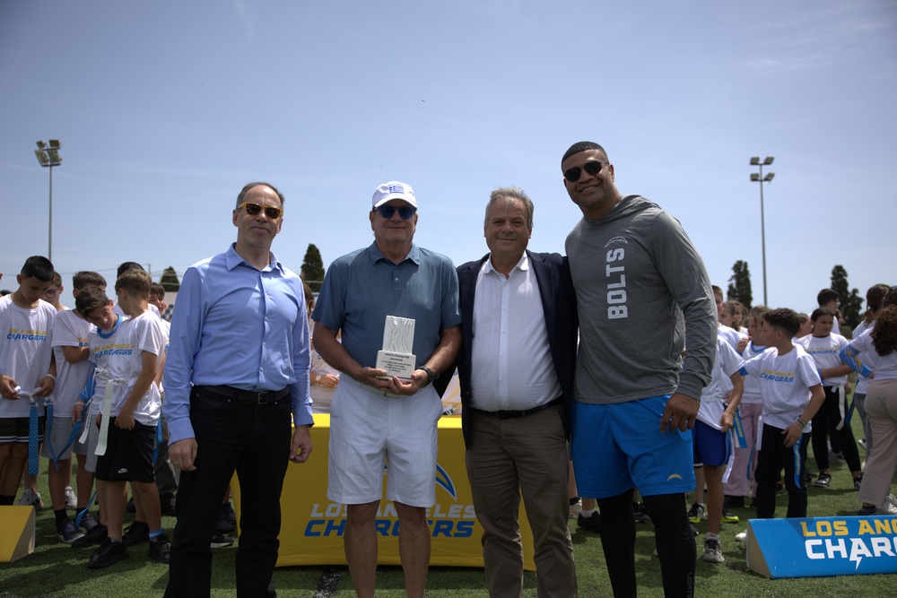 From left to right: George Mavrotas, General Secretary of Sports of Greece, Dean Spanos, Owner & Chairman of the Board of the Los Angeles Chargers, Panagiotis Karvelas, Mayor of Pylos-Nestor, Shawne Merriman, former Los Angeles Chargers Linebacker