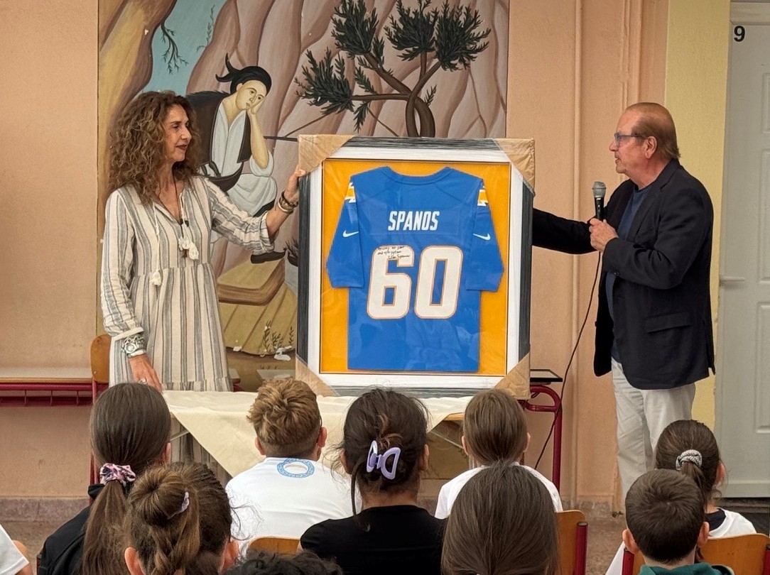 Visit of the Los Angeles Chargers to the Elementary School in Eva Messini — Pictured: Mr. Dean Spanos presenting an official signed Los Angeles Chargers jersey to the school principal