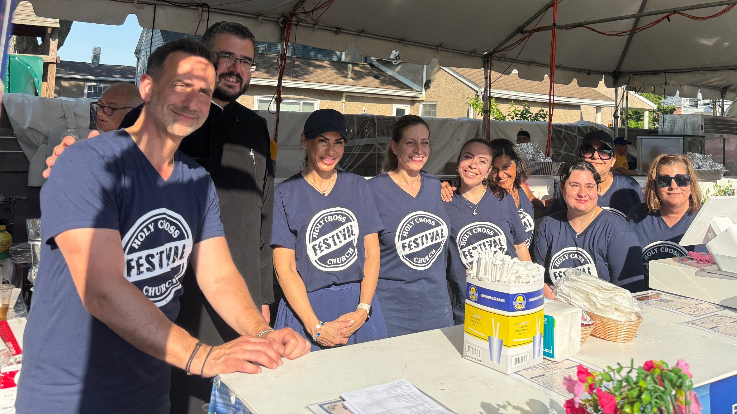 Festival Chairperson George Isaakiis (left to right), Rev. Paros and volunteers