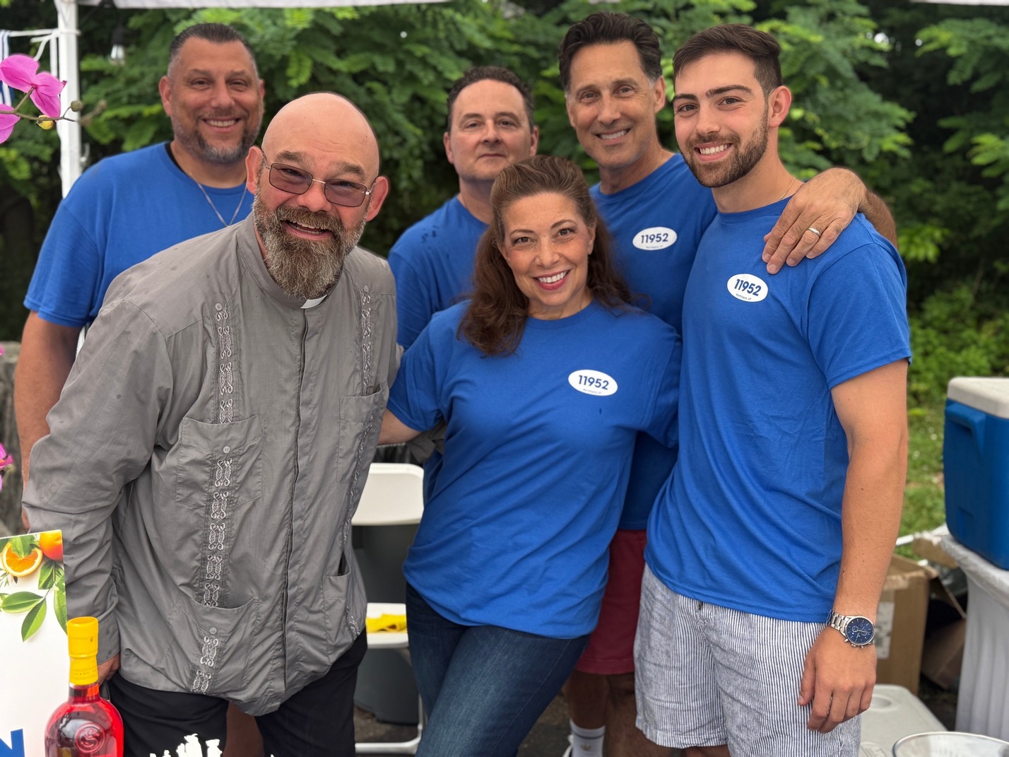 Volunteers with Father Andrew