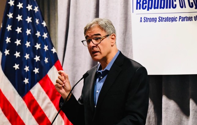 John Kiriakou addresses the group