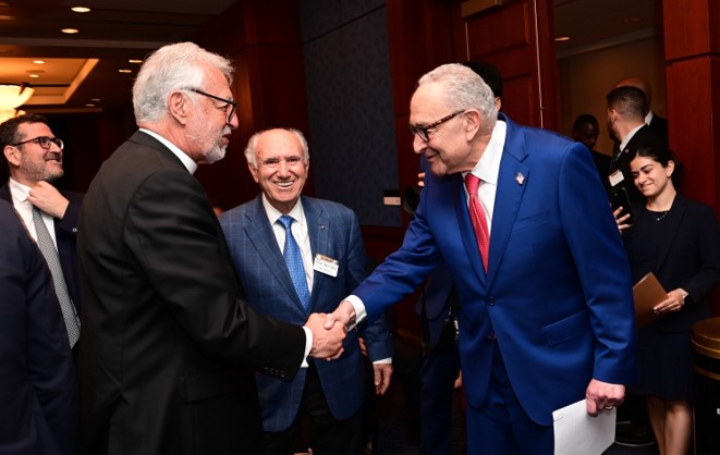The Grand Protopresbyter of the Great Church of Christ, Father Alex Karloutsos and Leader Schumer